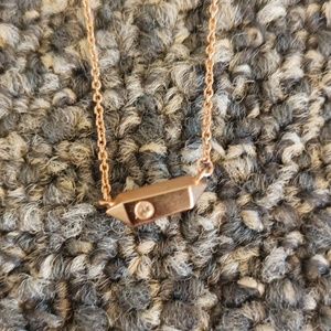 Kendra Scott rose gold necklace with small pendent and crystal